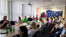 Participants of the meeting watching a presentation